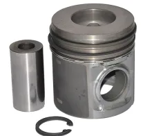 Metalowy tłok z cylindrem i pierścieniem zabezpieczającym, element silnika lub urządzenia.